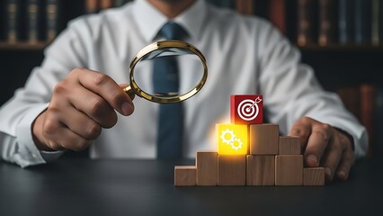 Businessman analyzing data with magnifying glass on wooden blocks