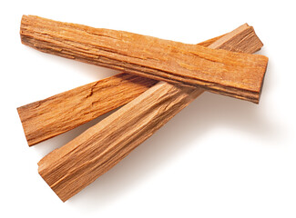 Red sandalwood sticks isolated on white background, top view.