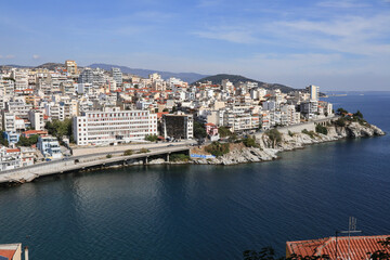 Obraz premium Aerial view of the port city of Kavala, Greece. Panoramic view of the City of Kavala from the water looking into the shoreline and the city