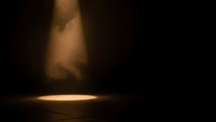 Dramatic spotlight illuminates a dark stage, creating a captivating scene.