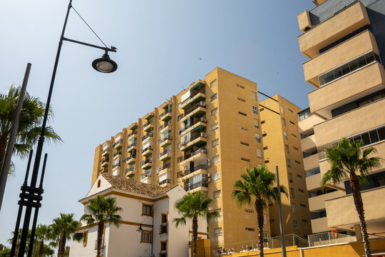 Street view of tall urban residential buildings.