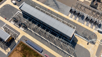 Aerial view high voltage substation, This facility essential distributing managing flow of electrical energy, Electrical substation with high voltage switches, wires, transformer, ceramic insulators.