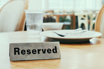 Table reservation concept with reserved sign