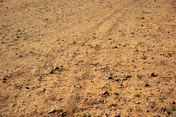 Tire tracks patterns on the gravel road texture