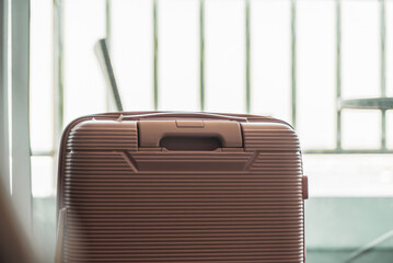 Travel luggage suitcase in hotel bedroom with blurred background