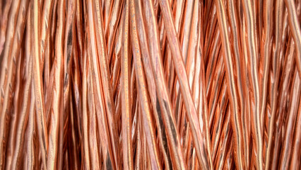 Aligned copper wires displaying consistent patterns and detailed textures in a parallel arrangement