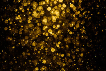 Blurred photo with golden dots visible glittering, shining brightly look and feel luxurious