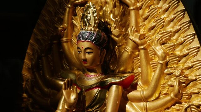 Golden Thousand-Armed Guanyin Bodhisattva Statue in Buddhist Temple