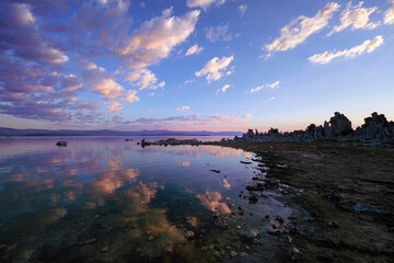 Sunrise reflection at Mono Lake with Tufa tower silhouettes, California