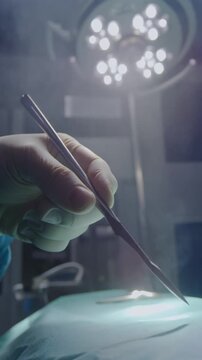 A surgical team performs a precise operation in a hospital operating room with a scalpel