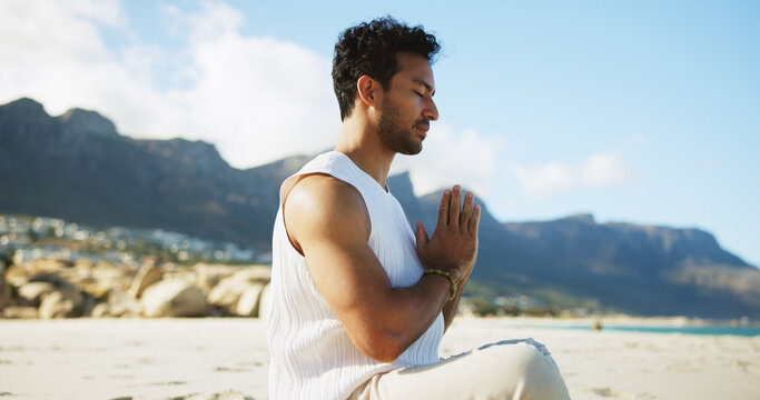 Zen, man and yoga at beach with meditation, prayer hands and peaceful moment for spiritual healing. Calm, person and mindfulness at ocean with mudra, namaste pose and chakra alignment for wellness.