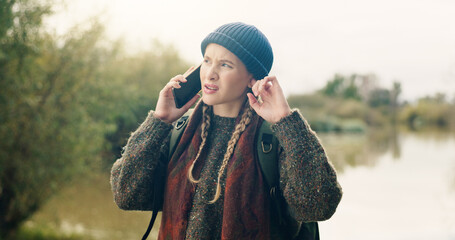 Hiking, woman and confused with phone call for no signal, bad connection and lost network on trip. Travel adventure, backpacker and listening to contact at lake with service error or reception glitch