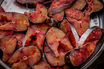 Selling raw fish in a traditional market