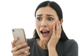 Young woman expressing shock while using smartphone