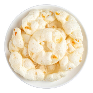 Malaysian keropok lekor, traditional fish crackers with a soft and chewy texture, often served with chili sauce, isolated on a white background