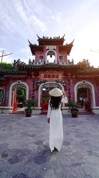 Tourist walking at Fukian Assembly Hall in the Hoi An ancient town, Vietnam.