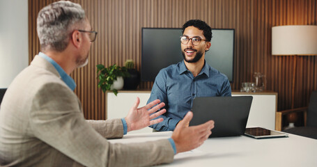 Obraz premium Meeting, laptop and business men in office with teamwork for stock market with finance report. Discussion, computer and male financial analyst with investor for investment proposal in workplace.