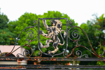 Wrought iron gate with lion crest at the historic Caparra ruins, the oldest European settlement in Puerto Rico