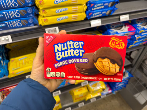 Nutter Butter Fudge Covered Peanut Butter Sandwich Cookies Box Held In Grocery Store Aisle