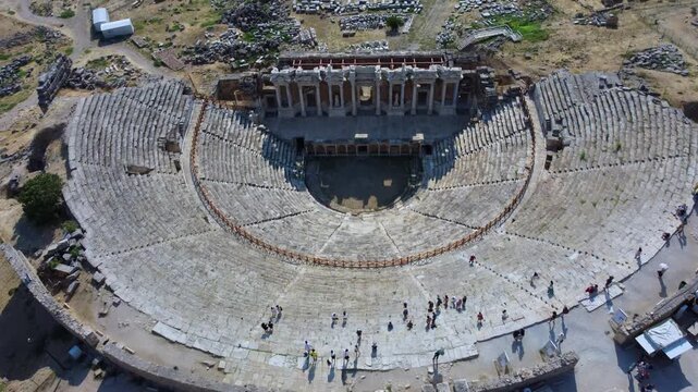 IERAPOLIS in Denizli, bird's-eye view, TURKEY, August 13, 2024: Ancient city of Ierapolis near Pamukkale, surrounded by nature and mountains. Phrygian period. UNESCO.4K