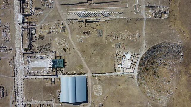 IERAPOLIS in Denizli, bird's-eye view, TURKEY, August 13, 2024: Ancient city of Ierapolis near Pamukkale, surrounded by nature and mountains. Phrygian period. UNESCO.4K