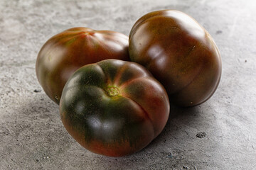 Obraz premium Ripe black juicy tomato cumato