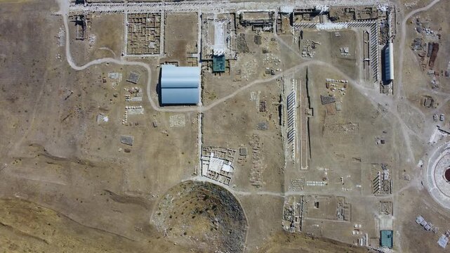 IERAPOLIS in Denizli, bird's-eye view, TURKEY, August 13, 2024: Ancient city of Ierapolis near Pamukkale, surrounded by nature and mountains. Phrygian period. UNESCO.4K