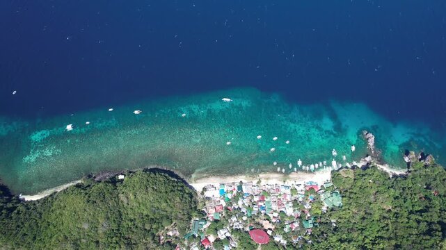 Apo Island from above. Cinematic footage of the best diving spot in the Philippines. 