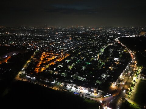 At night, the city transforms into a dream of light and shadow.
Each glowing street tells a story of people moving, waiting, and chasing tomorrow. From the sky, everything blends into one rhythm&mdash;stead