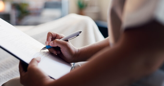 Person, hands and writing with medical form for healthcare policy, survey or treatment in clinic. Closeup, patient and filling application with clipboard in waiting room for health assessment or exam