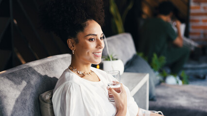 Happy woman, relax and water in clinic with iv drip, detox or antioxidants for hydration benefits. Person, smile and liquid in wellness center with intravenous fluid, vitamins or minerals for health.