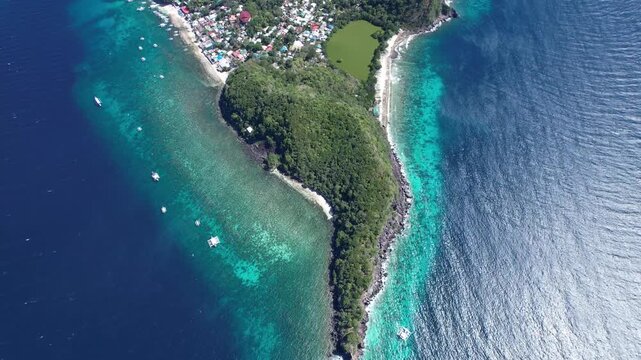 Apo Island from above. Cinematic footage of the best diving spot in the Philippines. 