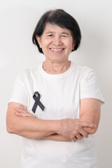 Elderly with Black ribbon for May Melanoma and skin cancer Awareness month, October Vaccine injury awareness month, Mourning Remembrance, March Sleep awareness week, Gang Prevention and Anti Violence