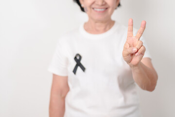 Elderly with Black ribbon for May Melanoma and skin cancer Awareness month, October Vaccine injury awareness month, Mourning Remembrance, March Sleep awareness week, Gang Prevention and Anti Violence
