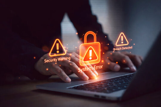 Laptop or Computer with digital security warning icons representing cybersecurity risk data breach online threat and information technology protection concept