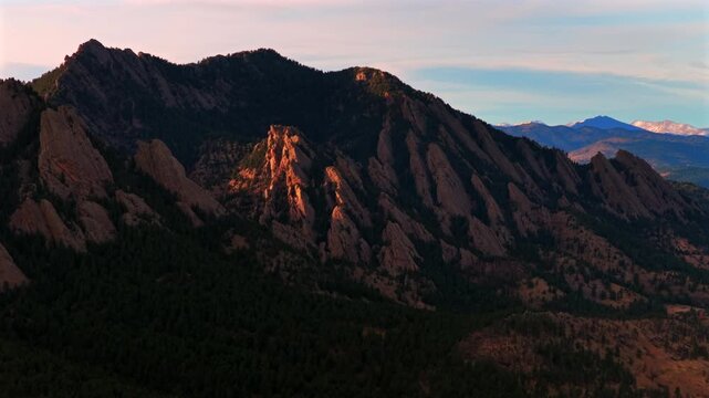 Eldorado Canyon Flat Irons Mountains vista Chautauqua Park Longs Peak Boulder landscape view winter aerial drone Colorado Front Range Rocky Mountains sunset sunny blue sky clouds parallax forward pan