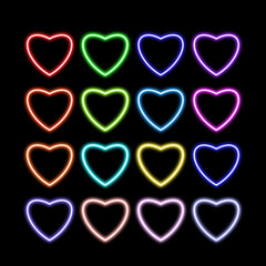 Neon hearts in various colors on a black background