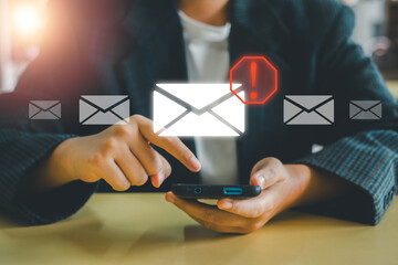 Close-up of hands using smartphone with email alert icon, representing digital communication and notifications.