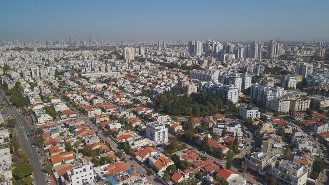 Holon Israel cityscape from above presenting typical apartment block architecture with distinctive red roofing in populated district