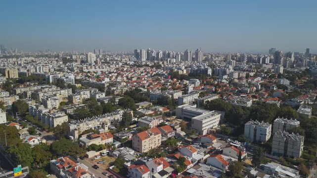 Urban Holon Israel aerial perspective showcasing densely packed residential buildings with traditional red rooftops in metropolitan area