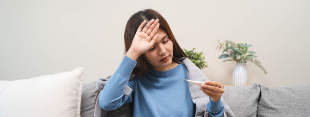 People sick in winter season, young woman coughing and feeling sore in her throat.