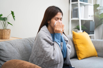 Sick in winter season common cold disease concept, Young woman have a runny nose and flu using...