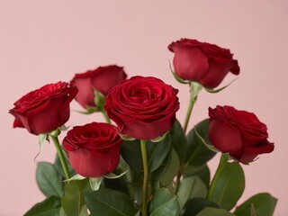 Fototapeta premium Elegant Bouquet of Fresh Red Roses on Soft Pink Background for Romance