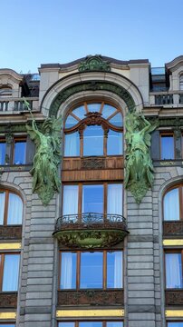 The Singer company's house in St. Petersburg on Nevsky Prospekt. A historic Art Nouveau building. Metal frame, bay windows and turrets decorated with sculptures of valkyries. A glass globe on the roof