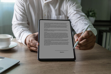 Crop Close up businessperson holding tablet contract at desk, Lawyer, broker or HR manager, Concept...