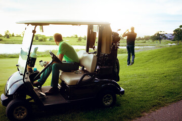 Watching, practice and man on golf cart, course and performance analysis for competition or fitness. Golfer, swing and training for skill development, people and coach on vehicle, sport and outdoor