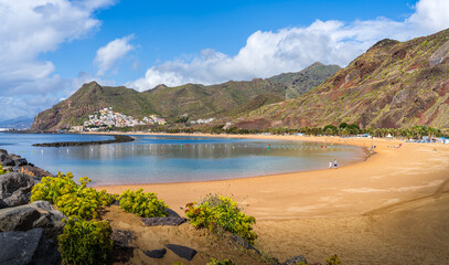 Las Teresitas Beach with its golden Sahara sands, nestled by Tenerife lush Anaga Mountains, and the charming San Andres village.