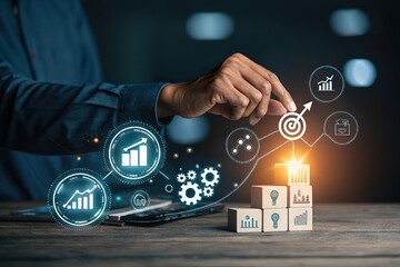 Business professional analyzing growth metrics with digital graphs and icons over wooden blocks