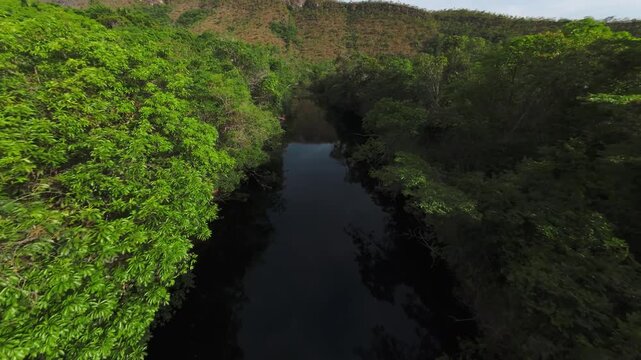 A sequence of low-altitude FPV drone images taken along the Rio dos Couros, in Chapada dos Veadeiros, Brazil. Showing the mountains of the Vale Dourado and the crystal-clear pools of the Goiano