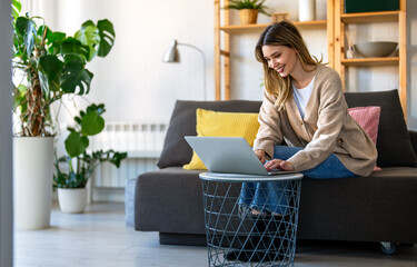 Young woman attending an online course from home, learning new skills through virtual education